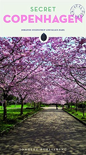 "Book cover with 'Secret Copenhagen' title, featuring a serene path lined with pink trees."