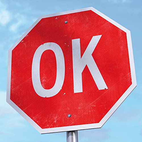 Red octagonal sign with large white letters spelling "OK".