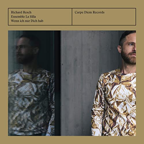 CD cover with mirrored portraits of a man in patterned clothing.