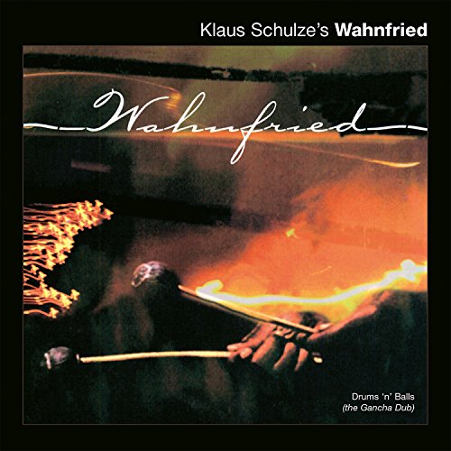 "Album cover with a person playing a drum surrounded by flames, black background."