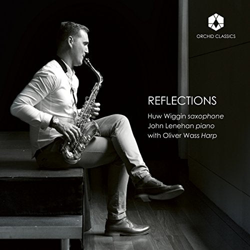 "Man sits on steps playing saxophone, black and white album cover with text."