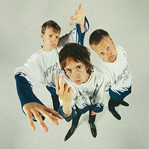 Three young men in white and blue sportswear, gesturing with hands.