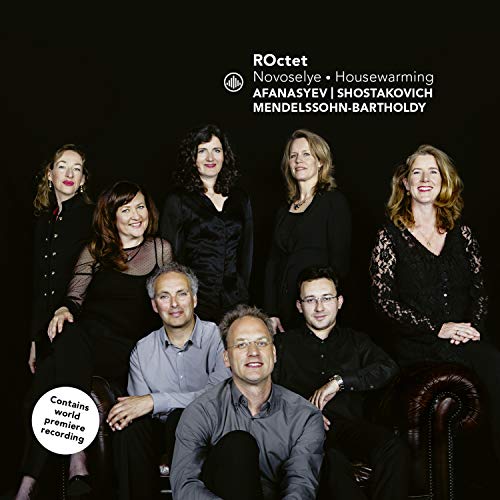 "CD cover featuring a group of eight musicians in black against a dark background."
