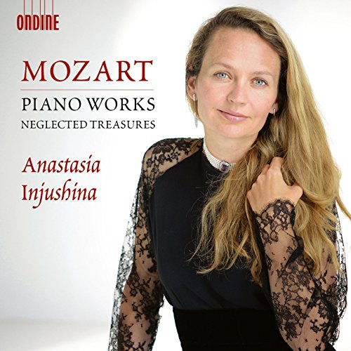"CD cover featuring a woman in black lace sleeves and text about Mozart piano works."
