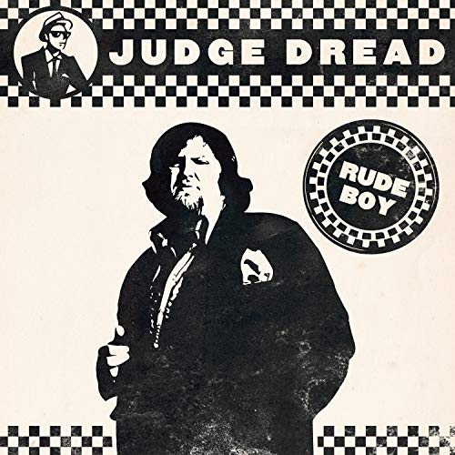 Black and white vinyl album cover featuring a man in a suit.