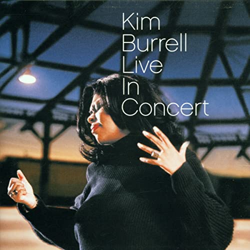 Kim Burrell album cover, a woman in a dark sweater raising hands.