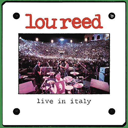 "Album cover with 'Lou Reed' in red, band performing on stage to a large crowd."