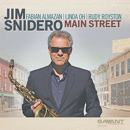 Man in dark suit holding saxophone, city street background, album cover.