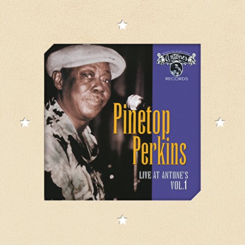 Album cover with a man in a hat on a beige background.