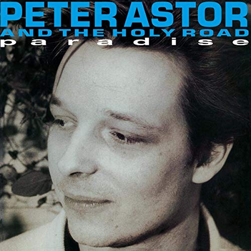 Vinyl album cover with a black-and-white photo of a man and blue text overlay.