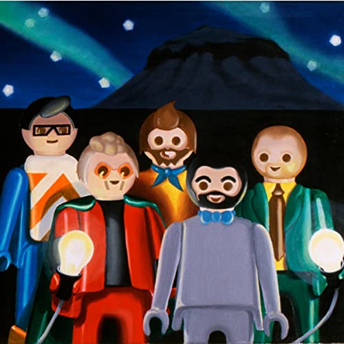 Painted figures resembling people with glowing lights, dark mountain backdrop.