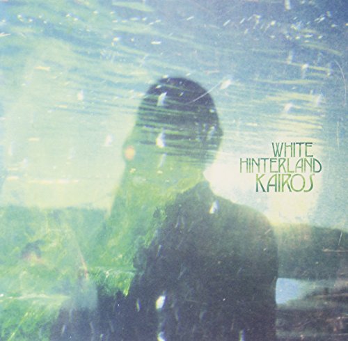 Blurred album cover for White Hinterland’s “Kairos” with text and figure.