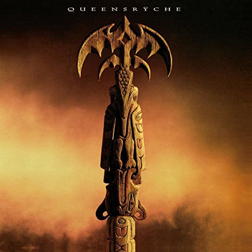 "Album cover featuring a carved totem pole against a cloudy orange background with 'Queensryche' text."