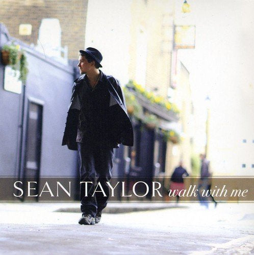 "Album cover featuring a man walking down a street with text 'Sean Taylor walk with me'."