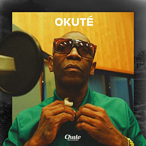 Vinyl album cover featuring a portrait of a man with sunglasses.