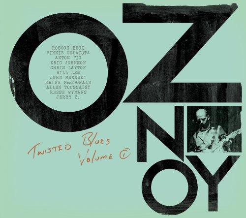 "Album cover with 'Oz Noy' in large black letters and a musician playing guitar."