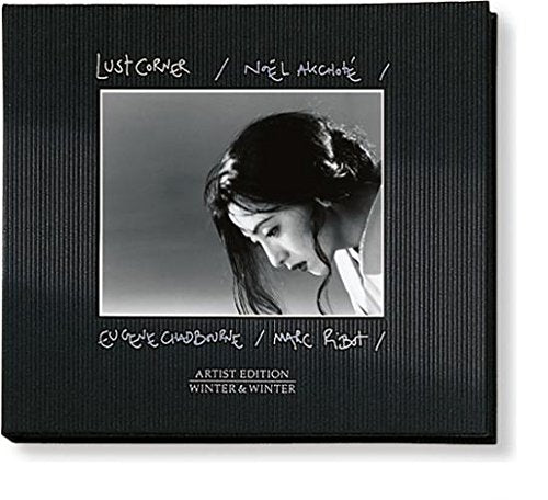 Dark green CD case with black-and-white photo of a woman and artist names.