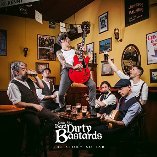 Band in pub setting, man mid-air playing red electric guitar.