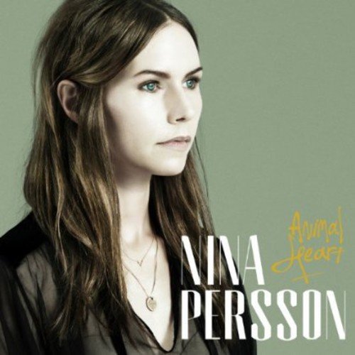 Nina Persson's album cover featuring her portrait against a muted green background.