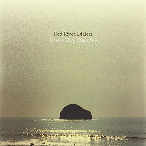 CD cover: seascape with a rocky island under a pale sky.
