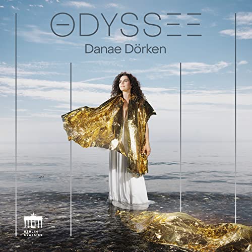 CD cover: Danae Dorken in white dress with gold fabric, seascape.