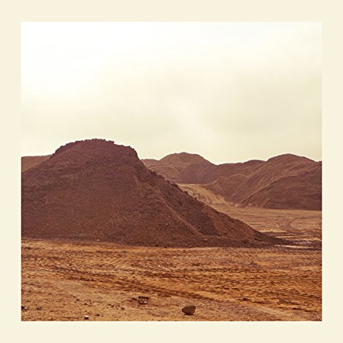 "Desert landscape with brown mountains and sandy terrain, surrounded by a beige border."