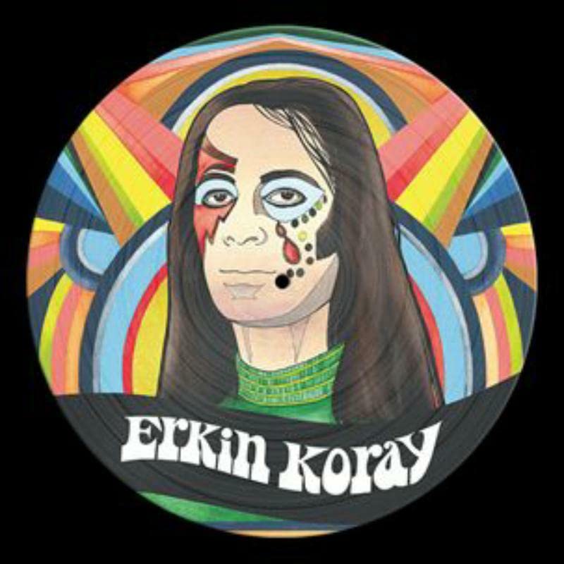 Colorful vinyl record cover with woman's face and Erkin Koray name.