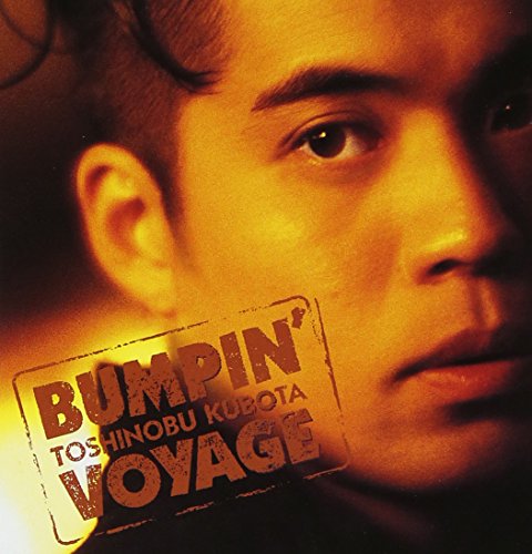 Close-up of Toshinobu Kubota on CD cover with "Bumpin' Voyage" text.