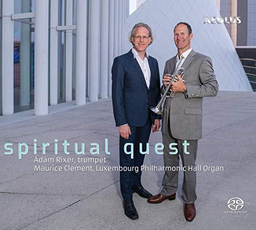 CD cover featuring two men, one holding a trumpet, with building backdrop.