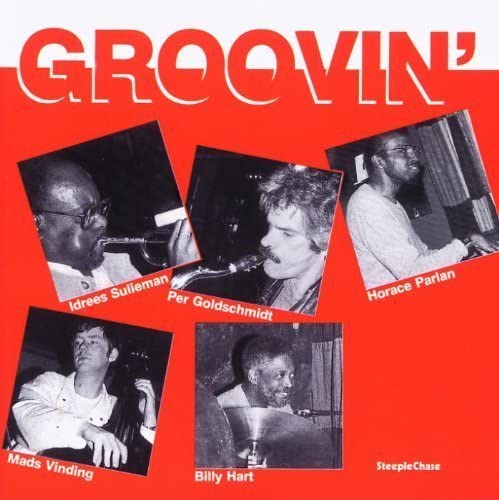 Red album cover with photos of jazz musicians playing instruments.