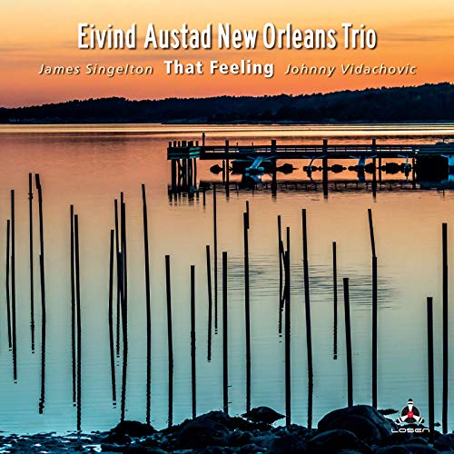 CD cover with a sunset over a marsh and wooden pilings.