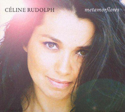 "Album cover featuring a close-up of a woman with dark hair and brown eyes."