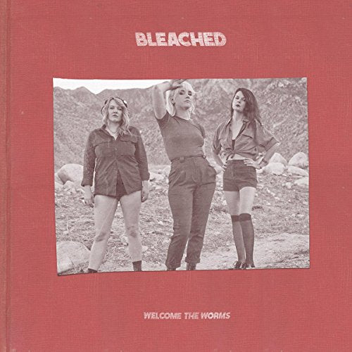 Bleached album cover: three women posing in a desert landscape.