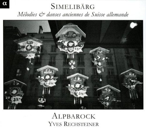 "Black and white CD cover featuring ornate clock towers in front of a building."