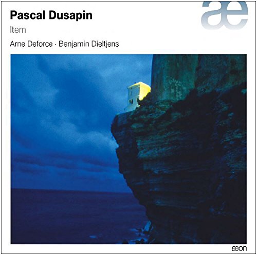 "CD cover art featuring a cliffside with a small lit building."