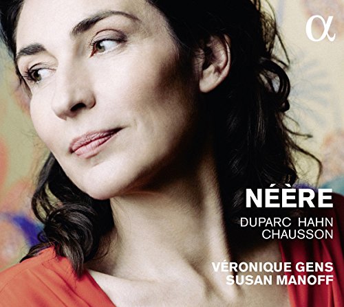 "CD cover with a woman in an orange top against a multicolored background."
