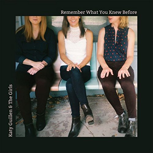 "CD cover featuring three women sitting on a bench, wearing casual clothing."