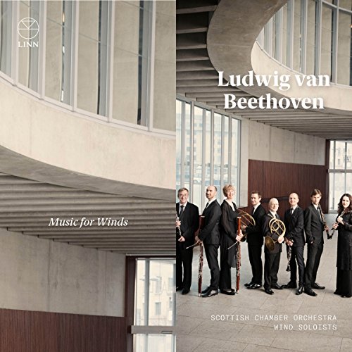 "CD cover featuring seven musicians holding wind instruments in a modern, curved building."
