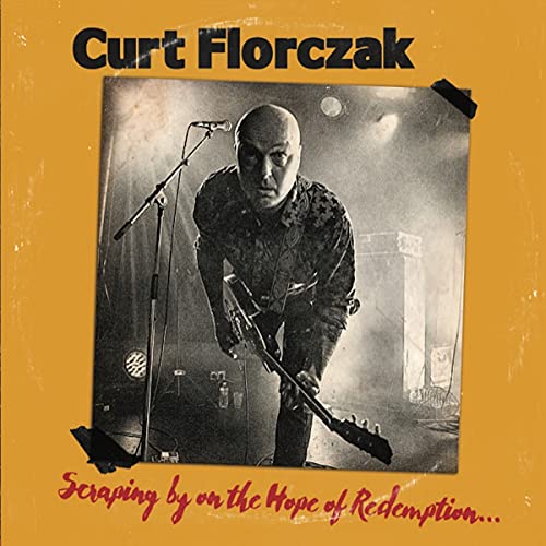 CD cover: black and white photo of a man with a guitar onstage.