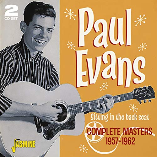 Black-and-white photo of man with guitar on orange album cover with white and red text.