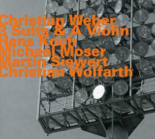 "CD cover with orange text and a black-and-white image of stage lights."