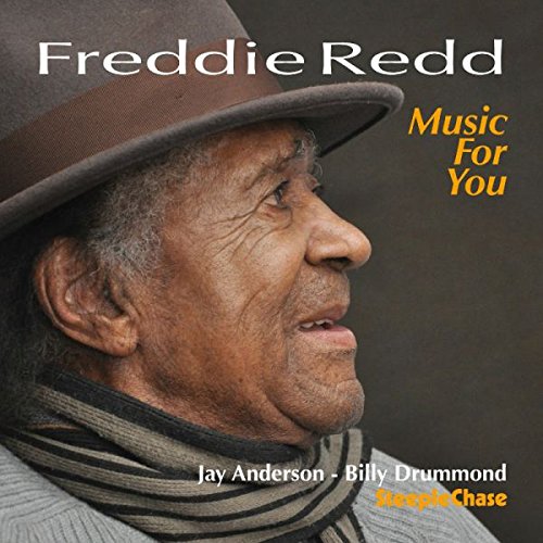 Album cover featuring Freddie Redd, an older man wearing a hat and striped scarf.