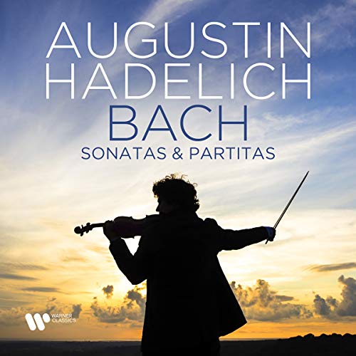 Silhouette of violinist against a vibrant sunset sky on a CD cover.