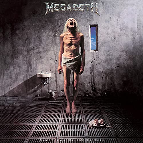 Megadeth album cover: emaciated figure in a stark, tiled room.