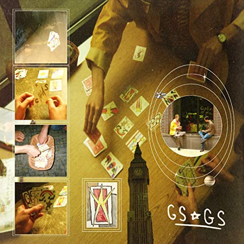 Vinyl record cover with collage of hands, cards, and city scenes.