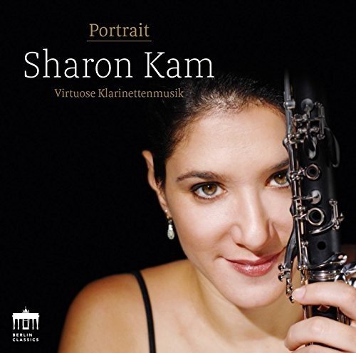 "CD cover featuring a woman holding a clarinet against a black background."