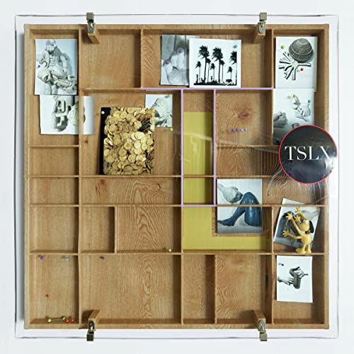 Wooden box with photos, objects, and a "TSLX" logo sticker.