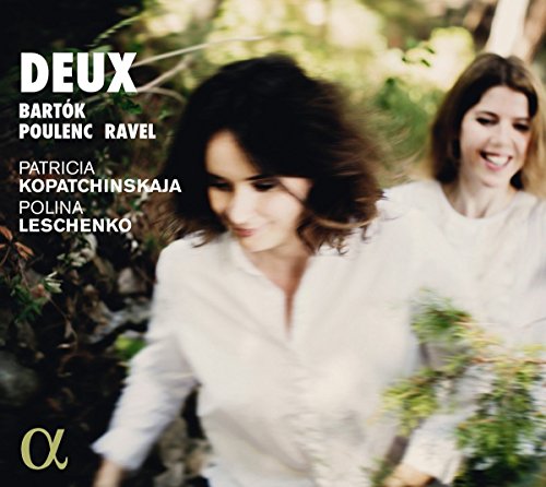 "CD cover with two women in white, surrounded by greenery, with text and logo."