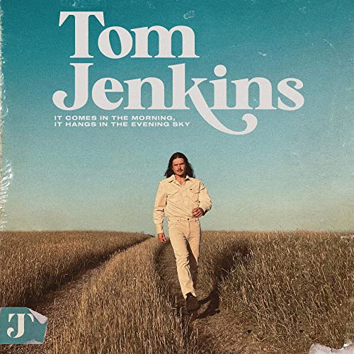 CD cover for Tom Jenkins’ album, featuring a man in a field.