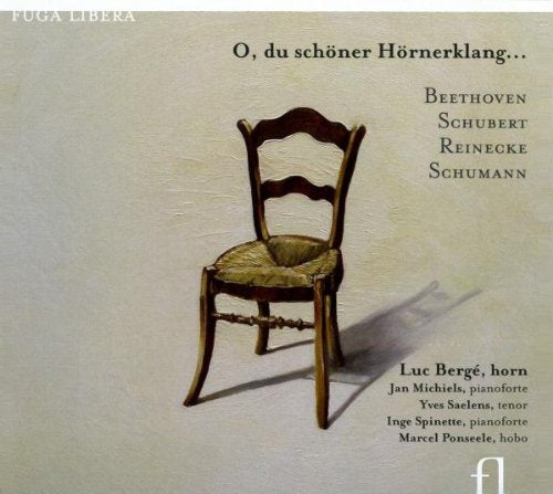 "CD cover featuring a wooden chair with a woven seat against a beige background."